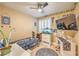 Bedroom with shuttered window, ceiling fan and desk work space at 664 Blue Crystal Creek Rd, Henderson, NV 89002