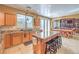 Charming kitchen with granite countertops and modern island with seating at 664 Blue Crystal Creek Rd, Henderson, NV 89002