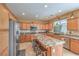 Well-equipped kitchen with stainless steel appliances, granite countertops, and a central island with seating at 664 Blue Crystal Creek Rd, Henderson, NV 89002