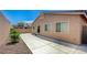 Exterior of home featuring private backyard with concrete and rock landscaping at 7822 Whitlocks Mill Ave, Las Vegas, NV 89147