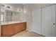 Bathroom vanity with double sinks and tile flooring at 7822 Whitlocks Mill Ave, Las Vegas, NV 89147