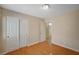 Bright bedroom features wood floors, ample closet space, and neutral paint at 7822 Whitlocks Mill Ave, Las Vegas, NV 89147