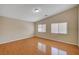 Bedroom with wood floors, recessed lighting, and two windows at 7822 Whitlocks Mill Ave, Las Vegas, NV 89147