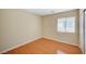 Bedroom featuring wood floors and a bright window at 7822 Whitlocks Mill Ave, Las Vegas, NV 89147