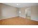 Bedroom featuring wood floors and arched doorway at 7822 Whitlocks Mill Ave, Las Vegas, NV 89147