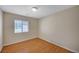 Bedroom featuring wood floors and a bright window at 7822 Whitlocks Mill Ave, Las Vegas, NV 89147