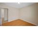The room has laminate flooring, and leads to another room with tiled flooring at 7822 Whitlocks Mill Ave, Las Vegas, NV 89147