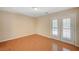 Bedroom features natural light and wood floors at 7822 Whitlocks Mill Ave, Las Vegas, NV 89147