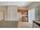 Kitchen with granite countertops, wood cabinets, and sliding glass door at 7822 Whitlocks Mill Ave, Las Vegas, NV 89147