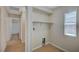 Laundry room with a window, built-in shelves, and tile flooring at 7822 Whitlocks Mill Ave, Las Vegas, NV 89147