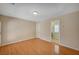 Spacious living room features sleek wood floors and neutral paint, perfect for relaxation and entertainment at 7822 Whitlocks Mill Ave, Las Vegas, NV 89147