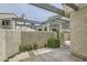 Shot of an outdoor courtyard with stucco walls and beams offering sun protection, highlighting the community's design at 8909 Antioch Way, Las Vegas, NV 89117