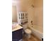 Clean bathroom with a shower-tub combo, vanity, and over-the-toilet storage at 921 Sulphur Springs Ln # 201, Las Vegas, NV 89128