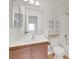 Bright bathroom with white vanity, modern fixtures, tile floors, white tiles, and a shower/tub combo at 921 Sulphur Springs Ln # 201, Las Vegas, NV 89128