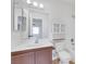 Bathroom featuring a toilet, tub, a wood-toned vanity, and a mirrored cabinet at 921 Sulphur Springs Ln # 201, Las Vegas, NV 89128