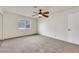 Bedroom with natural light, neutral carpet, a ceiling fan, and a closet with sliding doors at 921 Sulphur Springs Ln # 201, Las Vegas, NV 89128