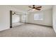 Bedroom with neutral carpet, a ceiling fan, natural light, and a mirrored closet at 921 Sulphur Springs Ln # 201, Las Vegas, NV 89128