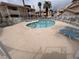Inviting community pool surrounded by a white fence, palm trees and lounge chairs for residents enjoyment at 921 Sulphur Springs Ln # 201, Las Vegas, NV 89128