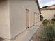 Exterior of a condo featuring tan stucco and matching trim at 921 Sulphur Springs Ln # 201, Las Vegas, NV 89128