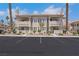 Low-rise residential building featuring stucco siding, private balconies and assigned parking in a gated community at 921 Sulphur Springs Ln # 201, Las Vegas, NV 89128