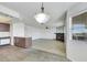 Open layout featuring wood floors, modern lighting, fireplace, and view into the kitchen at 921 Sulphur Springs Ln # 201, Las Vegas, NV 89128