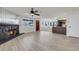 Bright and airy living room showcasing a fireplace, wood-look flooring, and open layout at 921 Sulphur Springs Ln # 201, Las Vegas, NV 89128