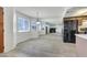 Open-concept living room with a fireplace, lots of natural light, and a view of the kitchen at 921 Sulphur Springs Ln # 201, Las Vegas, NV 89128