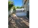 Backyard with concrete patio, minimal landscaping, and block wall for privacy at 9324 Pitching Wedge Dr, Las Vegas, NV 89134