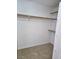 This walk-in closet features carpeted floors, white walls, and wooden shelves with plenty of storage at 9324 Pitching Wedge Dr, Las Vegas, NV 89134