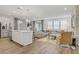 Open living area featuring stainless steel appliances, island, and modern lighting at 2742 Zazzera Ct, Henderson, NV 89044