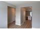Open-concept living space with hardwood floors leading to the kitchen with modern cabinetry at 3236 Walker River St, North Las Vegas, NV 89032