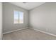 Bright bedroom features carpet, neutral paint and a window providing ample natural light at 3240 Walker River St, North Las Vegas, NV 89032