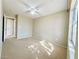 Spacious bedroom featuring a ceiling fan, neutral paint, and natural light from the windows at 3523 Calf Roper Ct, North Las Vegas, NV 89032