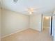 Neutral-toned bedroom with a ceiling fan and closet at 3523 Calf Roper Ct, North Las Vegas, NV 89032