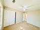 Bright bedroom with a ceiling fan, neutral walls, and a large closet for ample storage at 3523 Calf Roper Ct, North Las Vegas, NV 89032