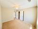 Spacious carpeted bedroom with a ceiling fan and closet at 3523 Calf Roper Ct, North Las Vegas, NV 89032