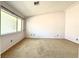 Neutral bedroom has large window at 3523 Calf Roper Ct, North Las Vegas, NV 89032