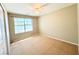 Bright bedroom with a ceiling fan and natural light coming in from the window at 3523 Calf Roper Ct, North Las Vegas, NV 89032