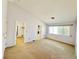 Bright bedroom features neutral tones and natural light from a large window at 3523 Calf Roper Ct, North Las Vegas, NV 89032