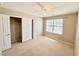 Well-lit bedroom with a ceiling fan and closet at 3523 Calf Roper Ct, North Las Vegas, NV 89032