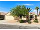 Single-Gathering home with a low-maintenance front yard and mature shade trees at 3523 Calf Roper Ct, North Las Vegas, NV 89032
