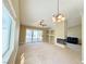 Inviting living room with a fireplace, a ceiling fan and sliding glass doors to the backyard patio at 3523 Calf Roper Ct, North Las Vegas, NV 89032