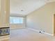 Bright and airy living room with a fireplace and large windows for natural light at 3523 Calf Roper Ct, North Las Vegas, NV 89032