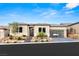 Modern single-story home with well-manicured landscaping, three car garage, and inviting entrance at 36 Thorn Creek St, Henderson, NV 89011