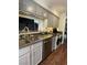 Modern kitchen featuring stainless steel appliances, granite countertops, and a sink with stainless fixtures at 682 Oakmont Ave # 1507, Las Vegas, NV 89109