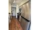 Stylish kitchen showcasing stainless steel appliances, grey cabinets, and hardwood flooring at 682 Oakmont Ave # 1507, Las Vegas, NV 89109