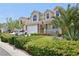 Beautiful two-story home with manicured lawn, desert landscaping, covered porch, and a convenient two-car garage at 7729 Natures Song St, Las Vegas, NV 89131