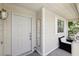 Close-up of front door and porch area, creating a warm and welcoming entry at 7729 Natures Song St, Las Vegas, NV 89131