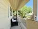 Inviting front porch offering a cozy seating area to enjoy the view at 7729 Natures Song St, Las Vegas, NV 89131