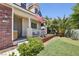 Charming front porch with a well-maintained yard and desert landscaping at 7729 Natures Song St, Las Vegas, NV 89131